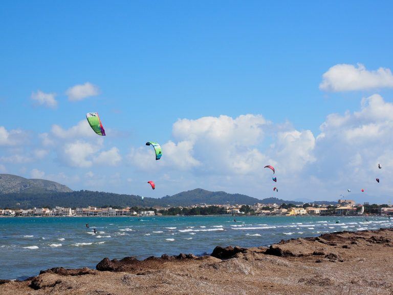 View of kitesurfers in Pollensa Bay